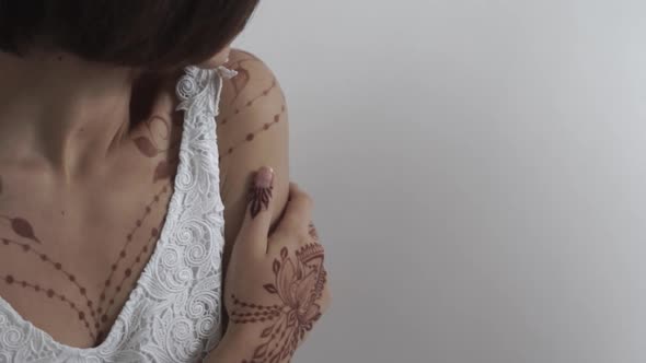 Charming Woman with Henna on Body