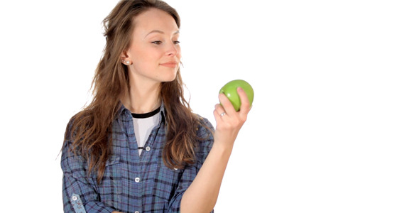 Beautiful Girl With a Green Apple in Hands