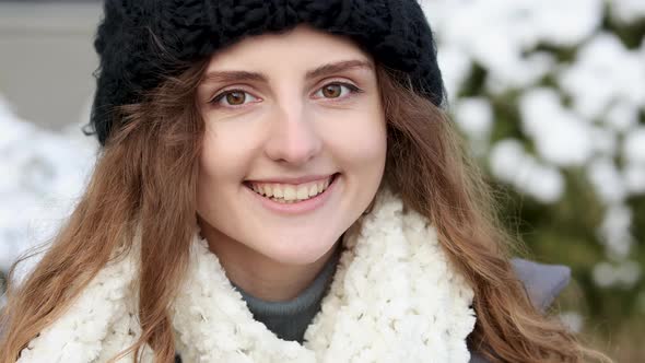 Close-up Portrait of Nice-Looking Curly Elegant Woman Looking Into Camera Stand on Winter Street