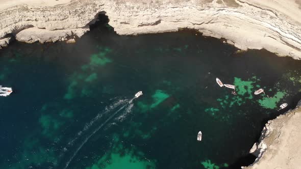 Aerial View of Tourist Boats in the Bay of the Rocky Shore of the Pure Sea Sea