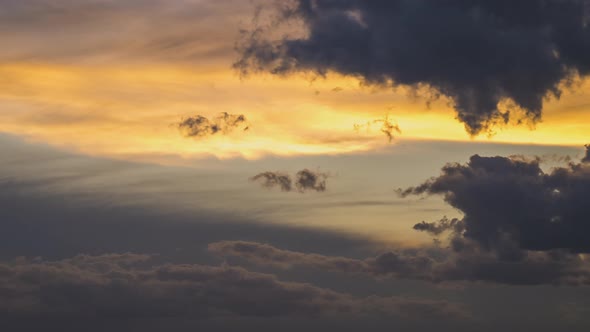 Time Lapse Footage of Fast Moving Clouds on Yellow Sky at Sunset