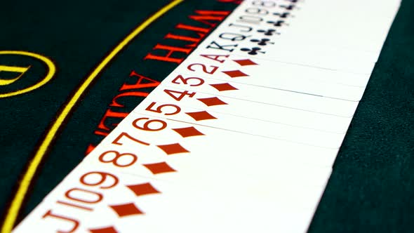 Playing Cards Are Spread Out on Poker Table, Close Up
