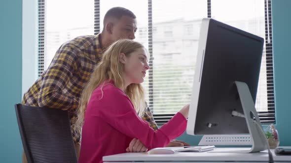 Man and woman looking at the computer