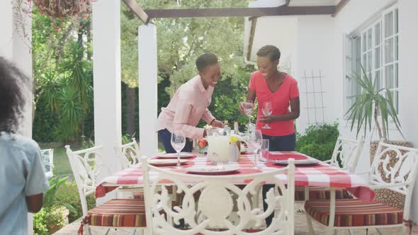 Happy family eating together at table