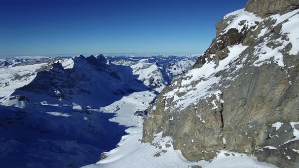 Flying over Snow Mountain Landscape