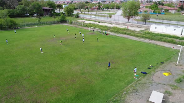 Children playing football in the stadium.