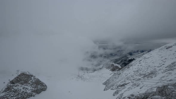 Timelapse of clouds covering mountains