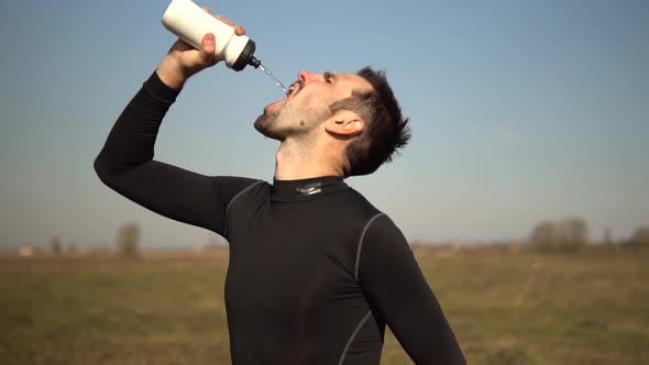 Athlete Cooling Down After Jogging Training On Trail.Tired Triathlete Jogger Relaxing After Workout.