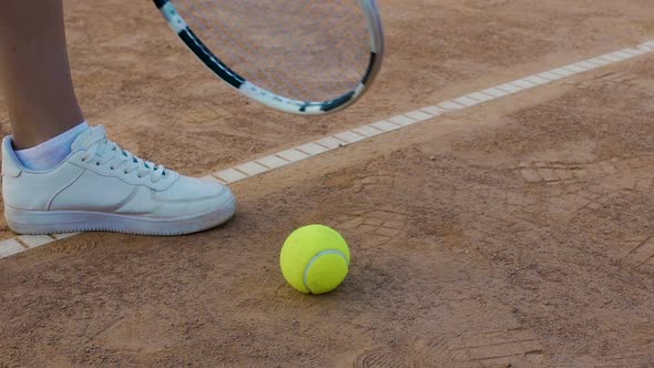 Active Woman Player Taking Tennis Ball, Ready to Serve It, Sports Competition