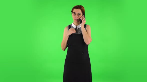 Funny Girl in Round Glasses Is Talking for Mobile Phone, Green Screen