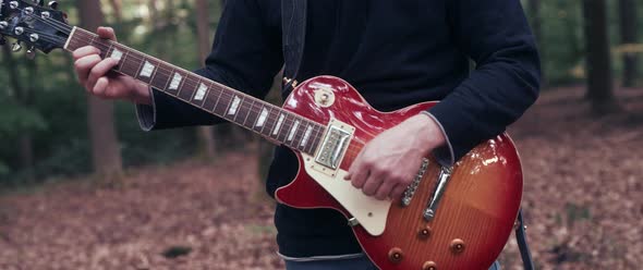 Guitar Player in the Woods