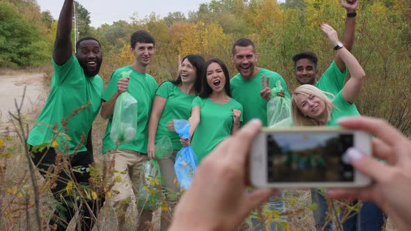 Multiracial Volunteers Posing for Photo in Nature