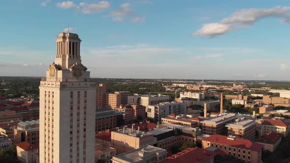 Aerial Drone shot of the tower on UT campus that slowly pans towards the football stadium.