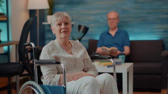 Portrait of Older Person with Chronic Disability Looking at Camera