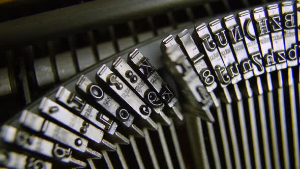 Typeset working on a vintage old mechanical typewriter typing manual