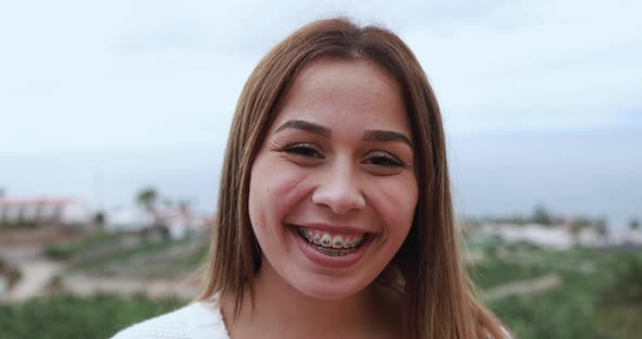 Young caucasian girl looking and smiling on camera