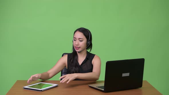 Young Beautiful Asian Businesswoman As Call Center Representative