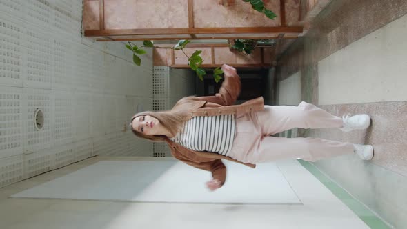 Woman Student Practices Dancing In Hall