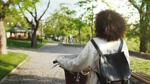 Darkskinned Lady in Casual Outfit and Backpack