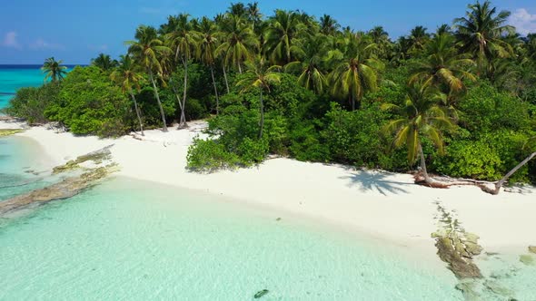 Aerial drone shot landscape of idyllic bay beach adventure by blue lagoon and white sand background 