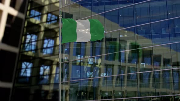 Nigeria Flag Waving On A Skyscraper Building