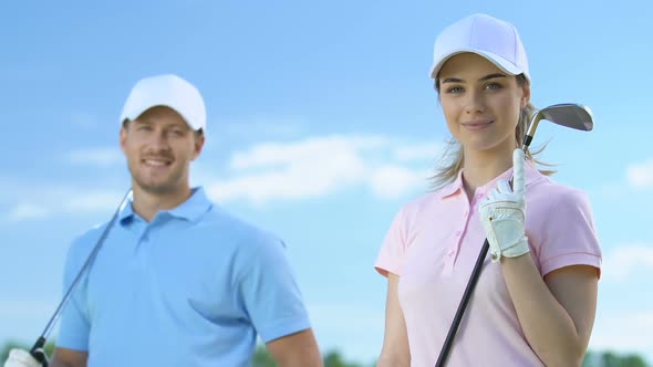 Man and Woman Members of Luxury Golf Club Posing With Clubs, Leisure Activity