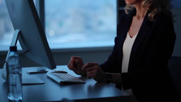 Business woman Stays Late in the Office