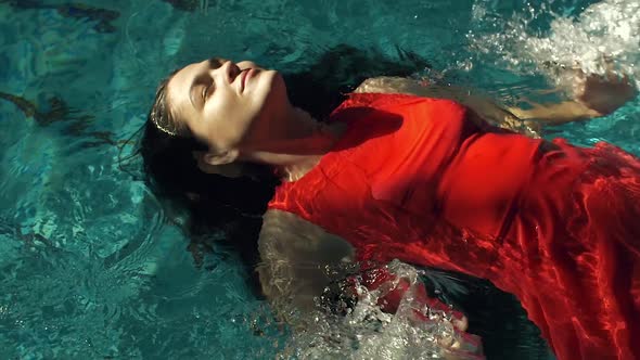 Woman in Dress Posing in Water