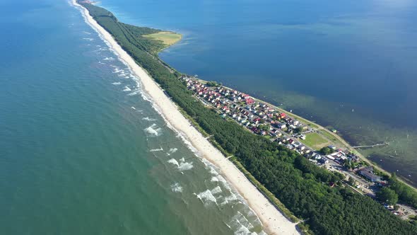 Beach in beautiful city Chalupy resort in Poland. Aerial video. Baltic Sea.Waves coming in.