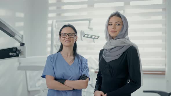 Two Young Women In Dental Office