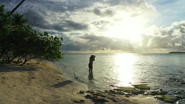 One woman suntans on beautiful tourist beach voyage by blue green sea and white sand background of t