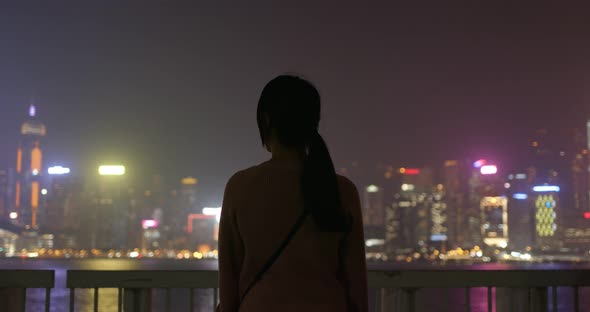 Woman look at the view in the city at night