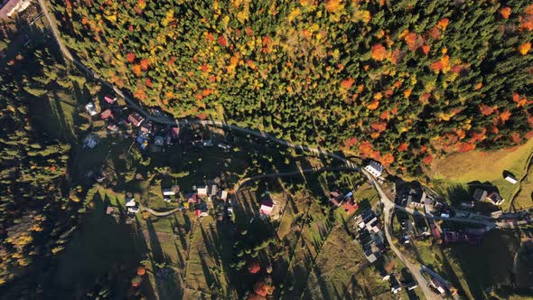 Aerial drone view of nature in Romania. Carpathian mountains, village in a valley