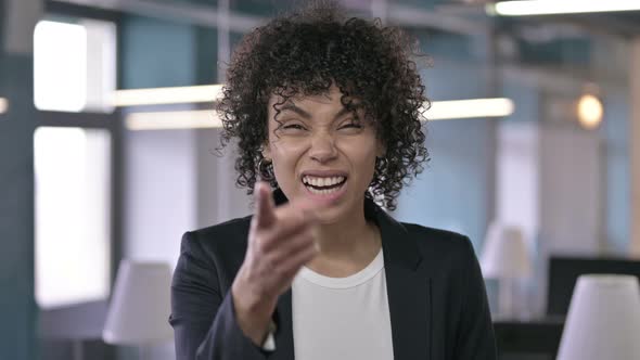 Portrait of Angry African Businesswoman Scolding and Shouting with Hand Gestures