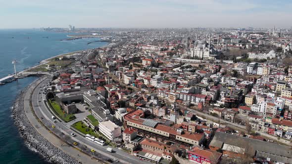 Sealing an Aerial View of Spring Istanbul. Roofs of Low Houses and Majestic Mosques