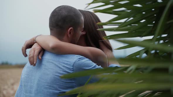 Happy couple in love kissing and hugging