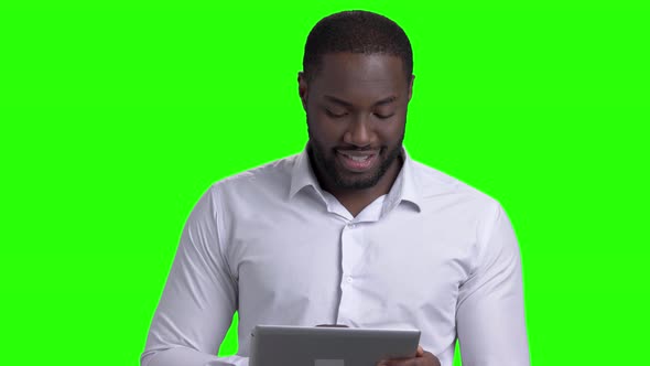 Handsome Afro-american Man Using Digital Tablet.