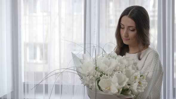 Romantic Woman with Bouquet of Flowers