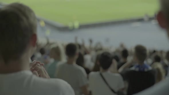 Fans at the Stadium During the Match. Slow Motion.