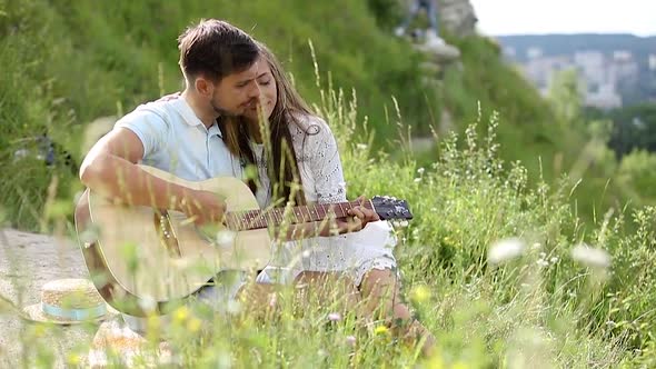 Young Couple In Love On Date Outdoors