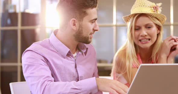 Smiling Casual Business Workers Working With Laptop