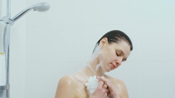 Woman with Closed Eyes Enjoying Shower at Home