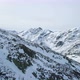 Forward Aerial Top View Over Winter Snowy Mountain Rock Peaks - VideoHive Item for Sale