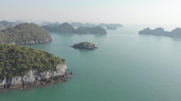 Aerial: unique flying over Ha Long Bay and Cat Ba island, famous tourism destination in Vietnam