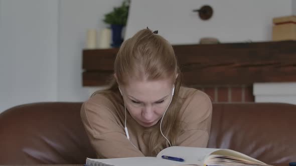 Portrait of Adult Woman in Earphones Coughing