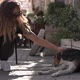 Girl with Long Curly Hair and Sunglasses Pets Homeless Dog - VideoHive Item for Sale