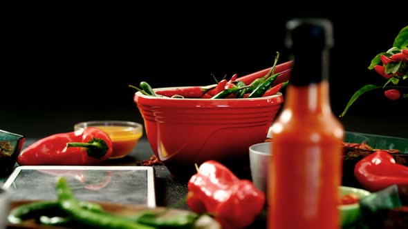 Various spices with digital tablet on black background 4k