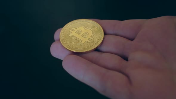 Bitcoin Coin in the Man's Hand