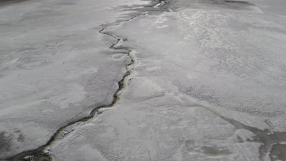 Drone flight over frozen landscape, Fosse dei Mergani, Castelluccio