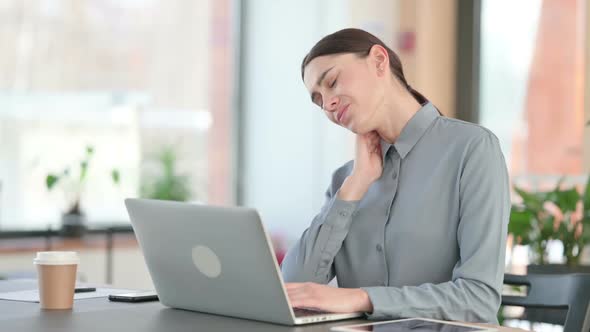 Young Latin Woman Having Neck Pain While Using Laptop